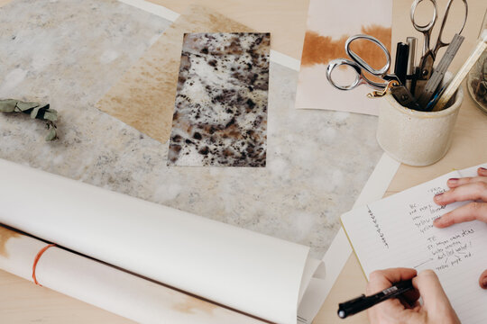 Artist looking at samples on desk