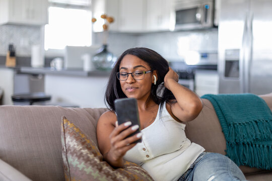 Woman Video Chats On the Couch