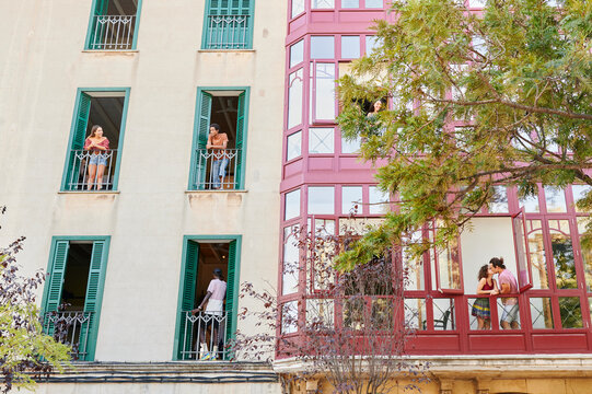 Young People Hanging Out On Balconies