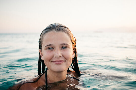 Happy girl swimming in the sea