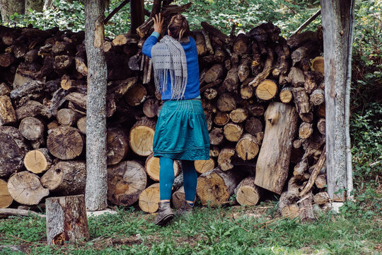 a woman in her woodshed