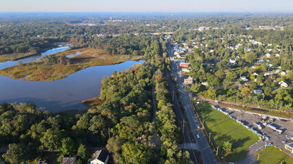 Fototapeta premium Aerial view of road at downtown of small town the traffic car road near river