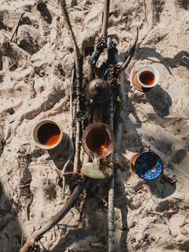 Top view of an impromptu tea table on the sand