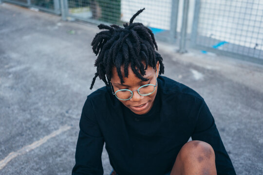 Portrait of a young African American woman with dreadlocks