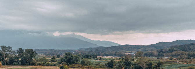 panorama scenic landscape of mountains and mist at sunset time in Nan Province, Thailand.