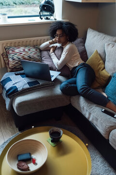 Afro Woman is Working from Home with a PC