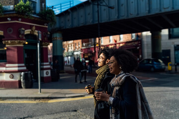 Young Black Couple Walking Downtown