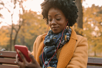 Afro Woman Listening Music With Earphones