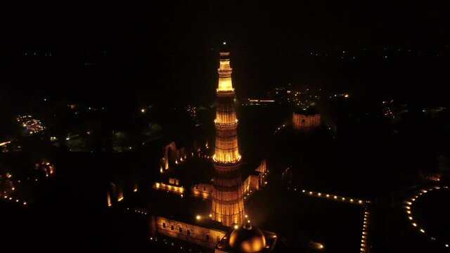 An Aerial shot of Qutub Minar in the night at New Delhi, India
