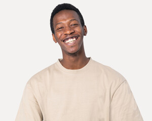 African American man in basic beige t-shirt studio shoot