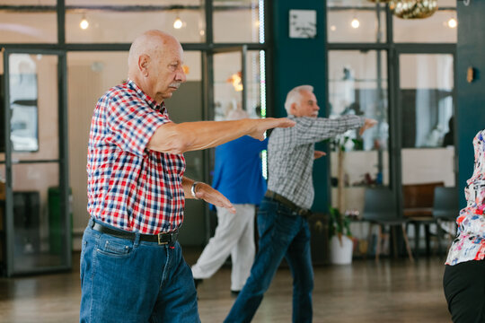 Senior Citizens Exercising Together Indoors
