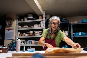 Woman Working in Pottery Workshop