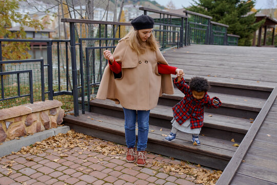 mother walks with her daughter on the arm