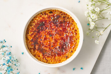 Creme brulee. Traditional French vanilla cream dessert. Burned cream, burnt creme or Trinity cream. Spanish crema catalana, rich custard base topped with layer of hardened caramelized sugar. Top view