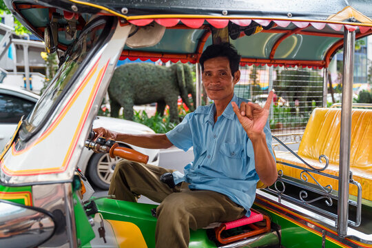 Tuk tuk taxi driver say Hi to the passenger