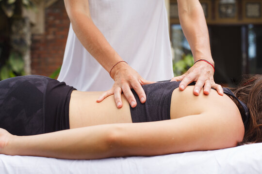Osteopath Woman Working With A Patient