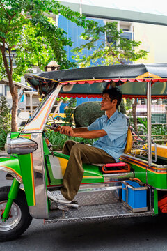 Tuk tuk taxi driver in Bangkok, Thailand.