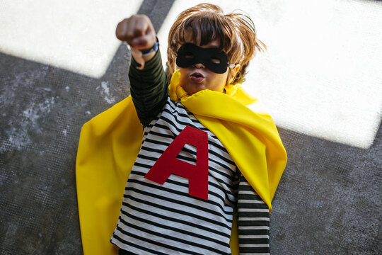 Funny superhero lying on floor