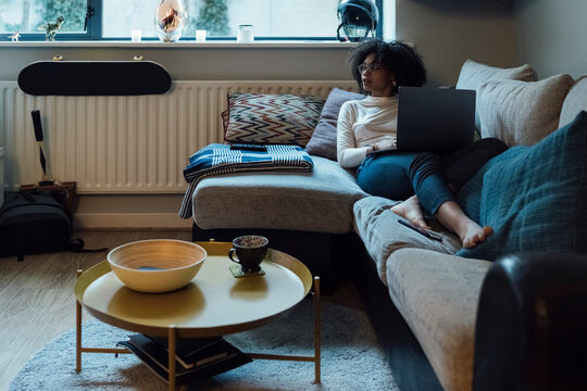 Afro Woman is Working from Home with a PC