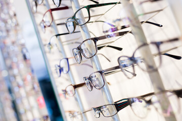Fototapeta na wymiar Image of glasses showcase at the modern optic shop, nobody