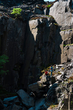 Climber climbing at stuning walls of the ancient Dinorwic Quarry at Snowdonia National Park in North Wales