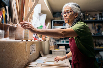 Woman Working in Pottery Workshop