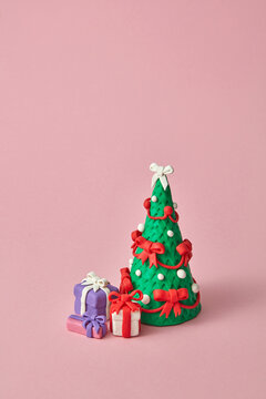 Handmade plasticine Christmas tree and gift boxes.