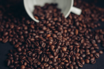cup of coffee with brown beans on a gray background close-ups macro photography