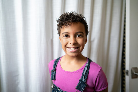 Grinning girl with freshly cut short hair