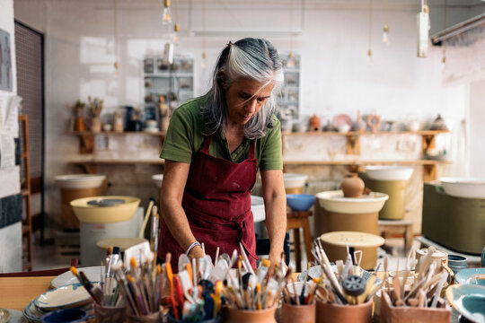 Woman Working in Pottery Workshop