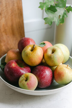 Green and red apples in a bowl