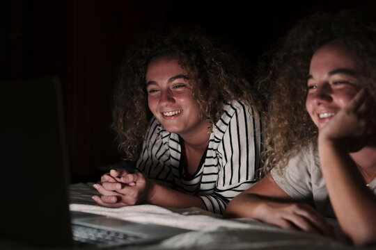 Twin sisters watching a movie