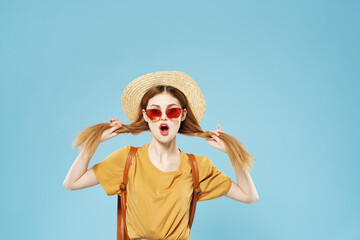 Fototapeta na wymiar Cheerful pretty woman in hat and sunglasses hair backpack emotions lifestyle