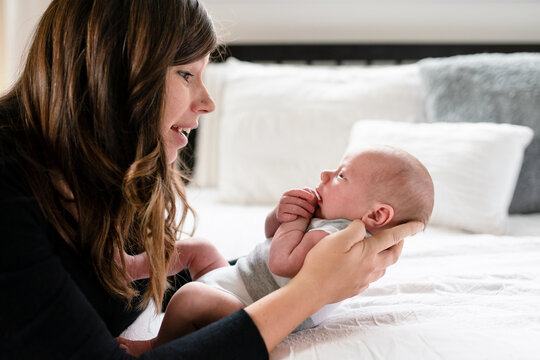 Mother talks to newborn