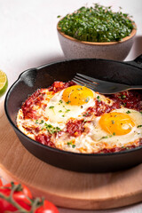 Traditional israel food eggs with tomatoes shakshouka in a pan