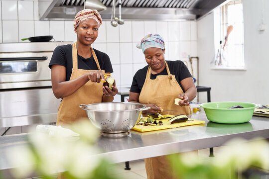 Women preparing food in a catering kitchen