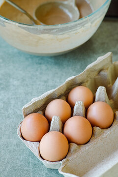 Chicken eggs in carton.