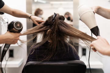 hairdressers combing a client