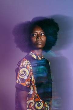 Black woman in neon purple lights