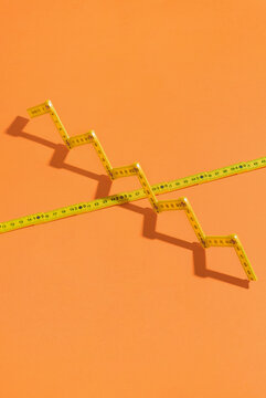 Measuring meters on orange background.