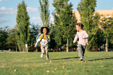 Cheerful Afro Little Girl and Friend Running