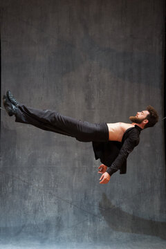 Circus performer lying on a slackwire (tele).