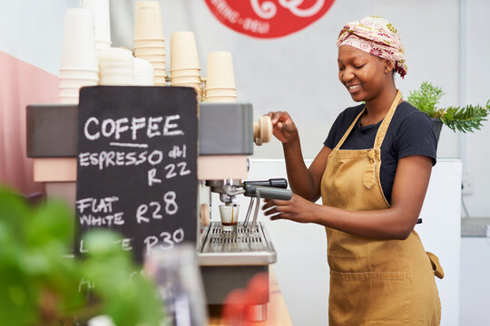 Barista making coffee at a local bistro