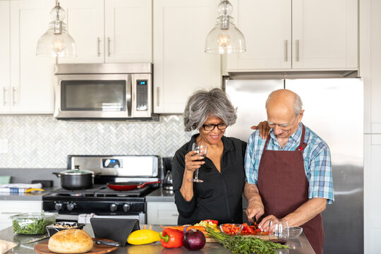 Wife Watches Her Husband Cut Peppers