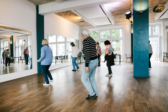 Dance Class For Elderly People In Bright Studio