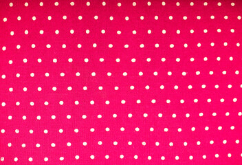Pink polka dot fabric for polka dots on light pink background.