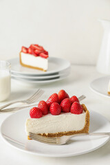 Plate with tasty strawberry cheesecake on table