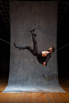 Circus performer on a slackwire in a dynamic pose