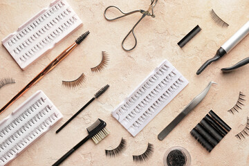 Composition with false eyelashes and tools on color background - Powered by Adobe