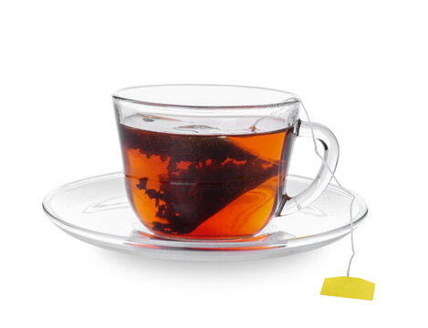 Cup of aromatic black tea on white background